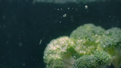 Green-fresh-broccoli-washed-in-clear-water-before-cooking-slow-motion